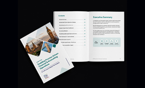 Open brochure spread on a dark surface, showing an executive summary page and bullet list with two photo cards nearby on the left.
