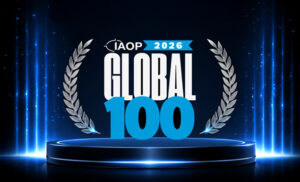 IAOP Global 100 2026 logo with laurel wreaths on a glowing blue stage.